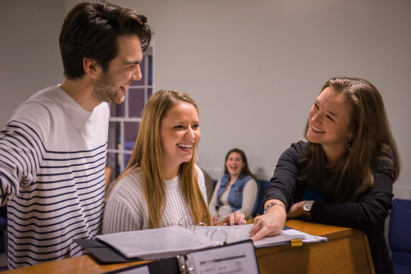 Smolos coaches students in a duet during her Vocal Production class