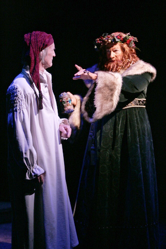 On stage as Scrooge with the Ghost of Christmas Present in A Christmas Carol